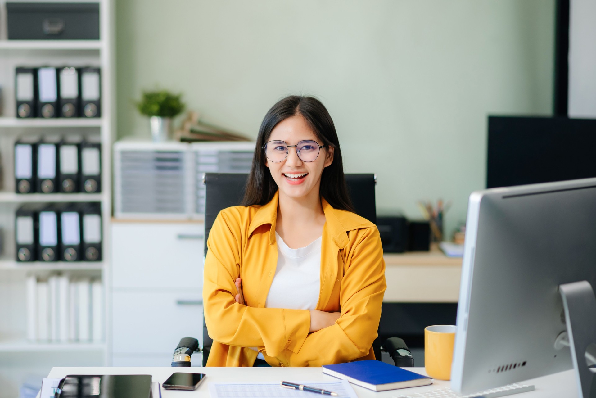 business expert attractive smiling young woman holding digital tablet  on desk